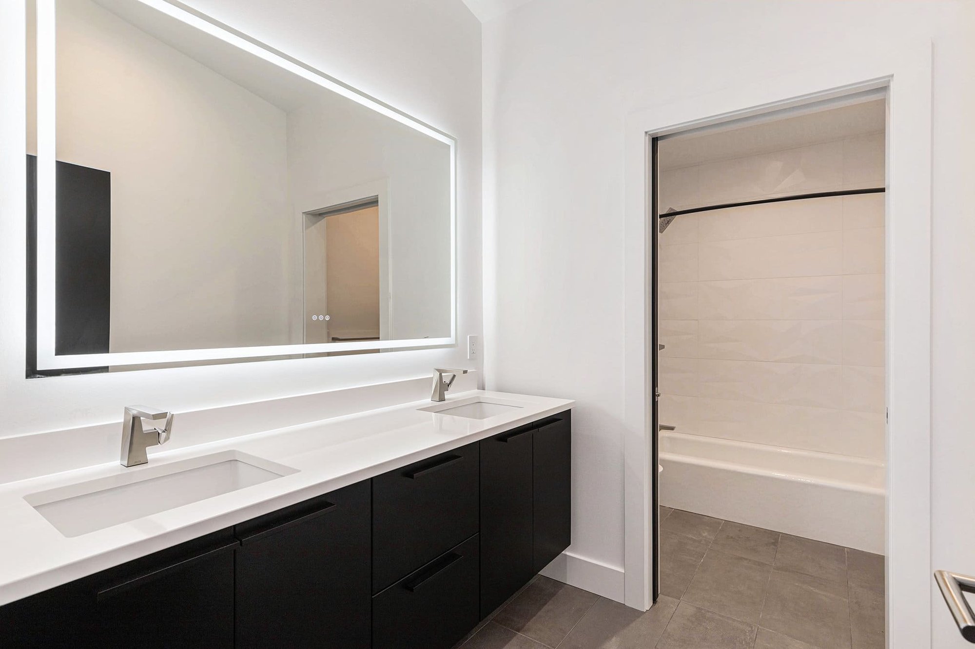 Bathroom with his and hers vanity in a custom home built by R-Value Homes in West Michigan Bathroom with his and hers vanity in a custom home built by R-Value Homes in West Michigan