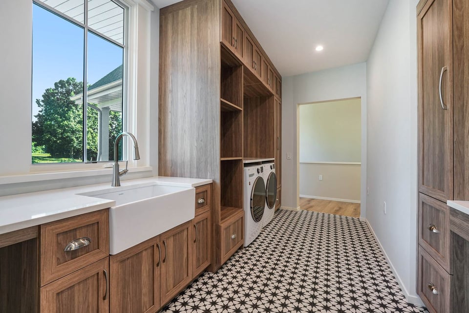 Farmhouse laundry room in West Michigan with custom storage