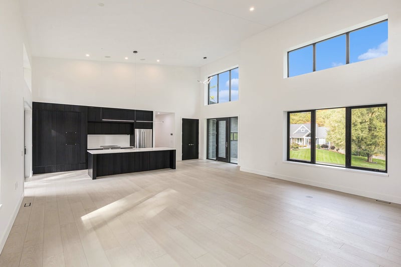 Open floor plan with modern kitchen and living room in West Michigan home