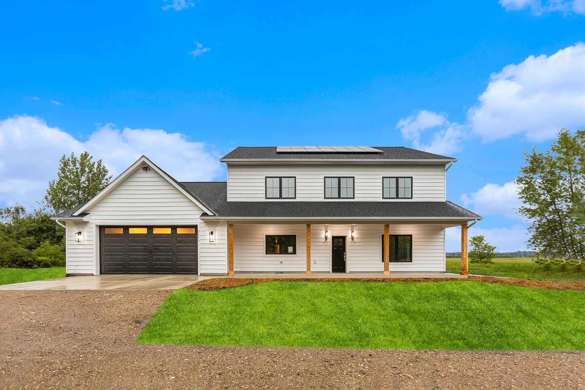 Front view of a solar-panel equipped home by R-Value Homes in West Michigan